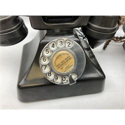 Three vintage Bakelite black telephones, each with chrome dial, one marked 'Standard London'