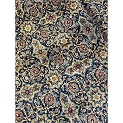 Persian Meshed golden blue ground Herati carpet, the field decorated with repeating floral Herati motifs, multi-band border decorated with scrolling foliate and flower head motifs