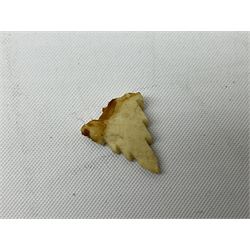 Hardwood bust of an Indoniesian Goddess, carved wearing a pierced headdress, from Klungkung, Bali, H20cm, together with a pair of bone carvings of deity figures, and a carved wood Netsuke in the form of a Chinese dragon