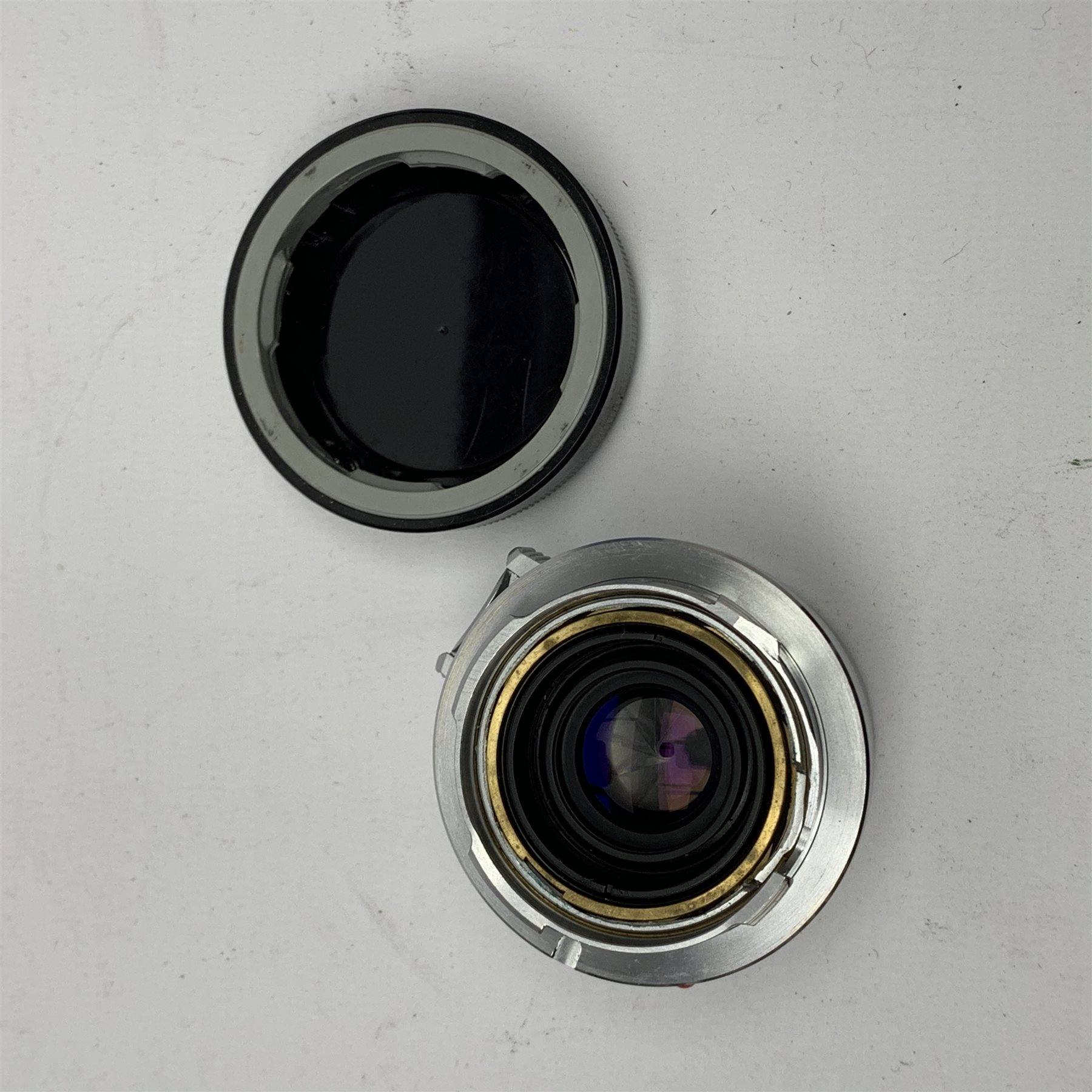 Leica M2-1013180 camera fitted with Leica Summicron 1:2/50 Leitz Wetzlar lens (1764800) and UVa filter, and Leica-Meter MR in leather case together with; Leica Elmarit 1:2.8/90 LW lens (1805634), Leica Summaron 1:28/35 LW lens (1782507), Leica M3 M2 adapter ring, Leica filters yellow and orange cased, three Leica lens hoods IUFOO, IROOA and 12585H (boxed), Leica pocket book, guide and 1960s survey catalogue & price guide leaflet, with original M2 camera box