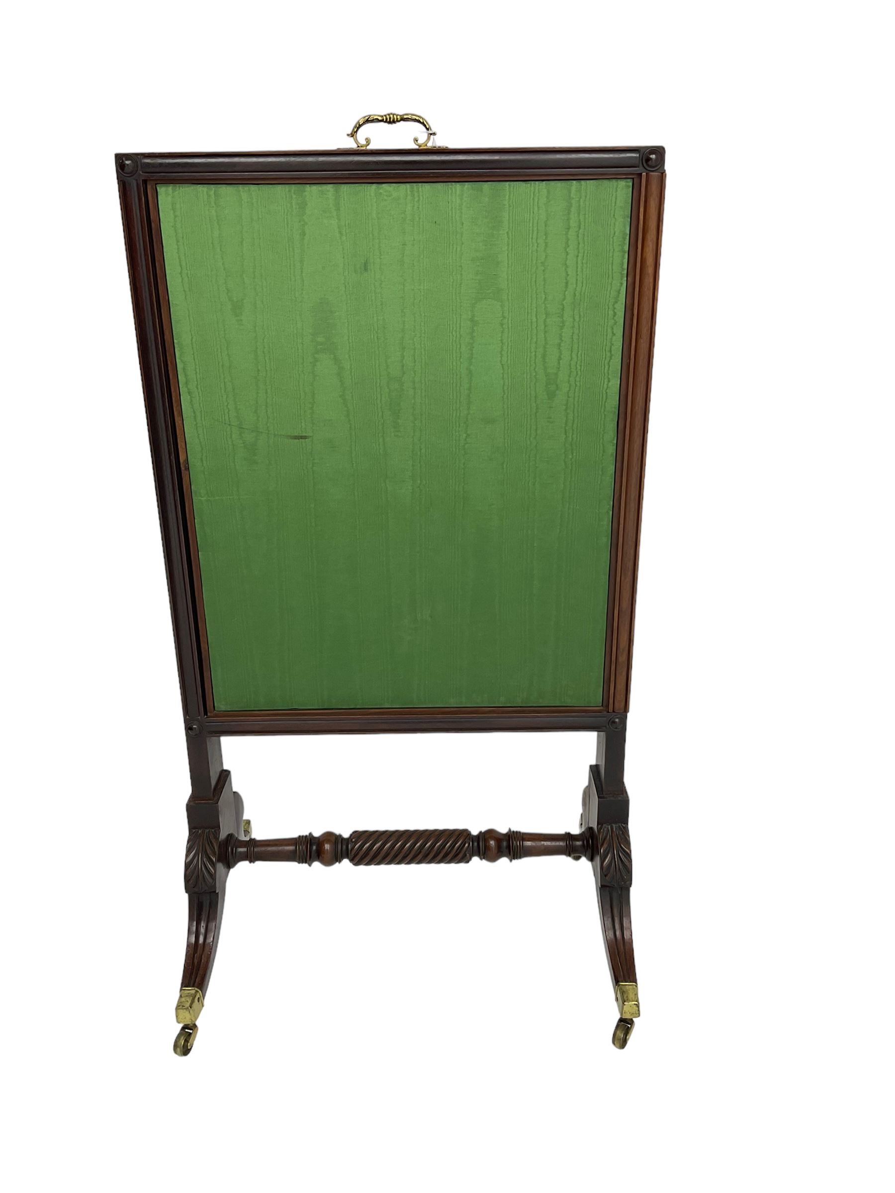 Regency mahogany screen with two horizontal and one vertical pull-out panels, on base with carved sabre legs and rope-twist stretcher