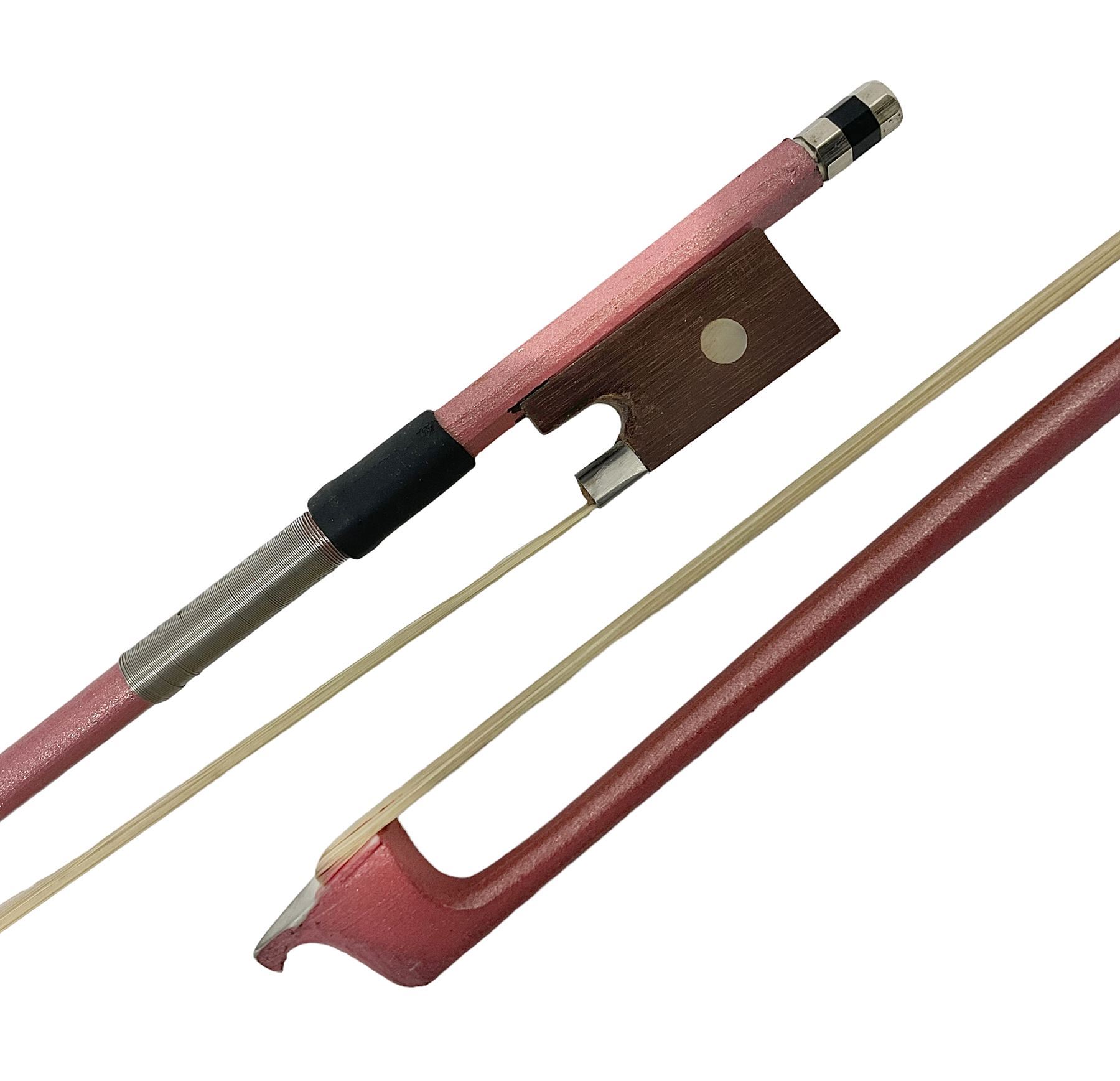 Zest full size pink violin, with a solid wood body and maple head, with matching pink bow and two further bows, in a hard case Length 60cm