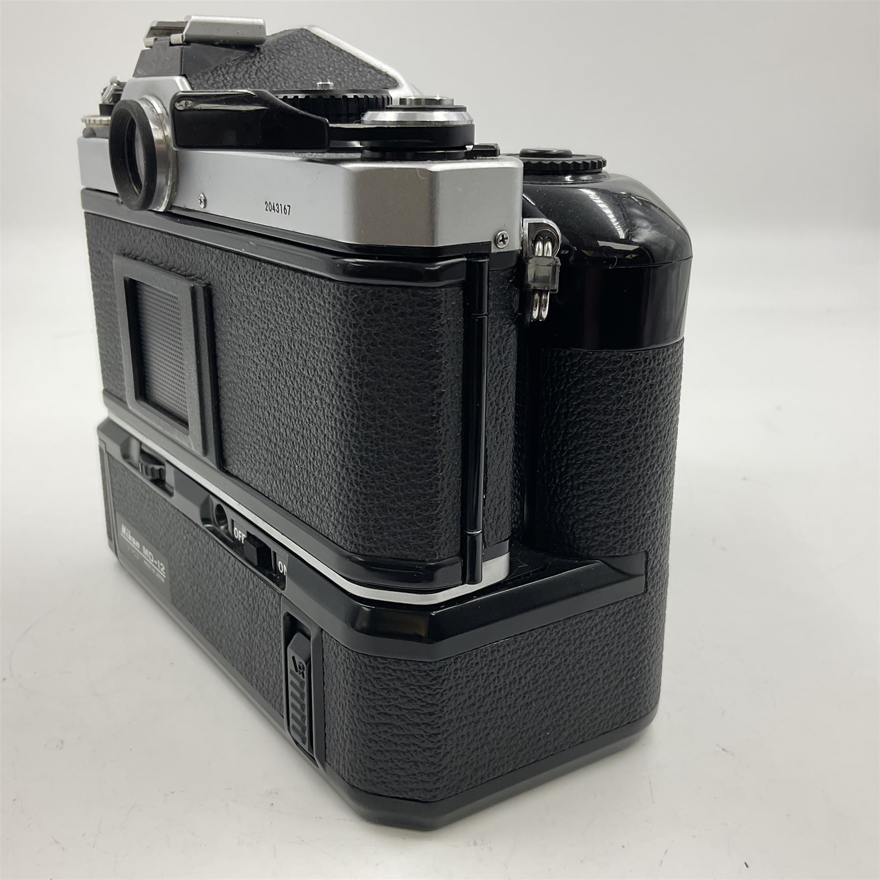 Nikon FE2 camera body, serial no. 2043167, with 'Nikon Zoom-NIKKOR 35-70mm 1:3.3-4.5' lens, serial no 3006624 and Nikon MD-12 Motor Drive, serial no. 1679037