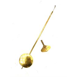 Mid-19th century mahogany veneered eight-day four-pillar single fusee drop dial wall clock with an octagonal dial surround and scroll brass inlay, circular painted steel dial with roman numerals and minute track, matching trefoil steel hands, brass bezel with a flat glass, curved trunk with brass inlaid circles and stringing around the glass pendulum aperture with a brass slip, carved ear pieces in the form of flowers and leaves, with pendulum adjustment door and movement door. With Pendulum & Key