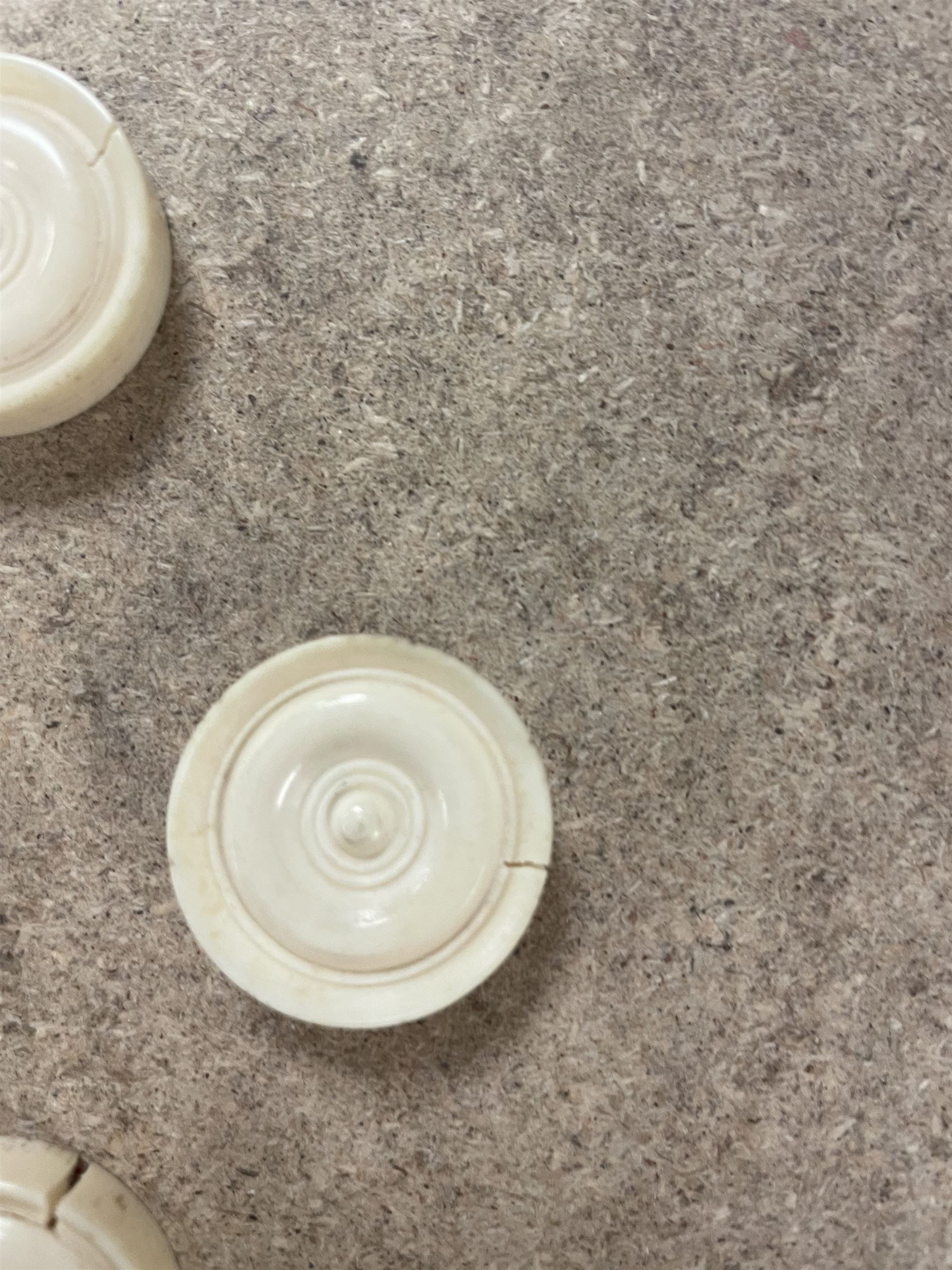 19th century walnut and brass bound games compendium box, painted to enhance the grain, of rectangular form, the hinged opening cover with rounded sides, central brass cartouche with engraved lion crest, and brass riveted straps, opening to reveal a red leather and blue silk lined compartmented interior, with fold-down games board, and lift-out tray containing playing cards, ebony turned dice towers, white and red stained bone draughts, and chess pieces, ivory dice, and ivory and ebony whist markers, and brass bezique board, cribbage board and markers, H15cm W32cm D24cm
This lot has been registered for sale under Section 10 of the APHA Ivory Act