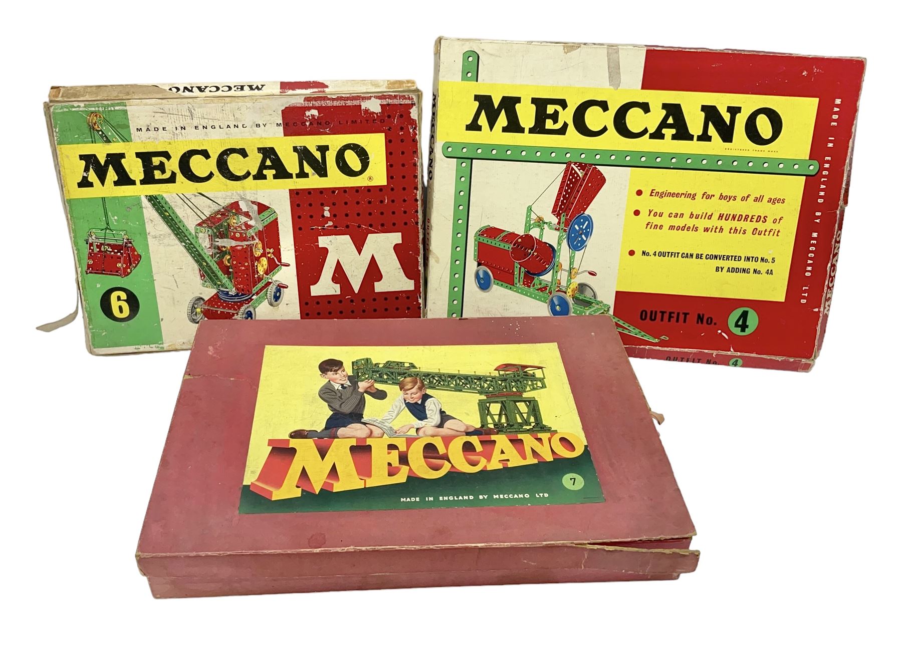 Meccano - Outfits 4, 6 & 7 with red and green parts; Outfits 4 & 6 virtually fully stocked and Outfit 7 containing large quantity of loose parts; Outfits 4 & 7 with instruction manuals; all boxed (3)