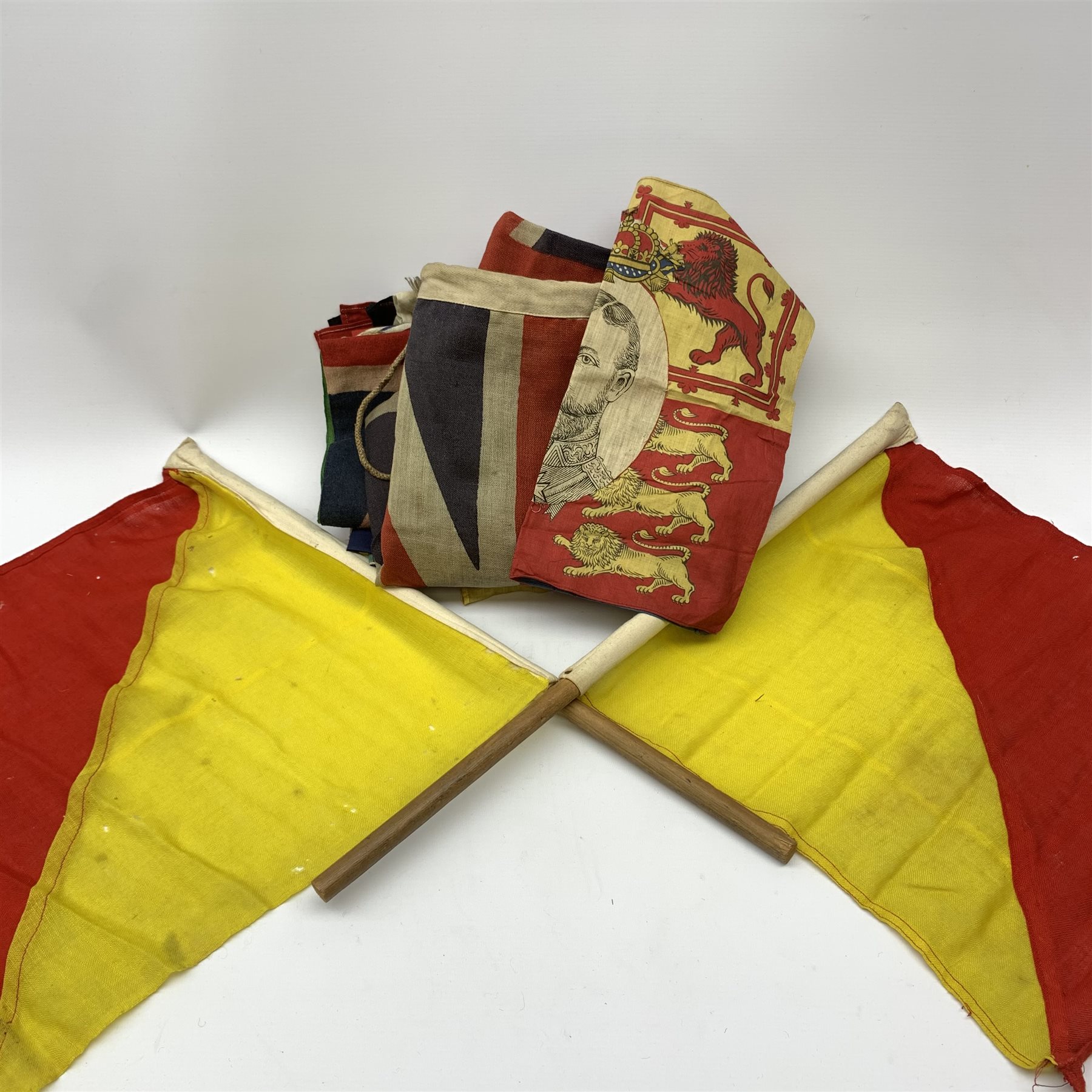 Thirty-seven various flags, pennants etc including Union flags, blue ensign, white ensign, Royal Standard, Scottish Rampant, Wales, Old Canada red ensign, Australia and New Zealand, France, Germany, South Africa (1928-94), semaphore and signal flags, 'God Save The King' banner, bunting flags etc