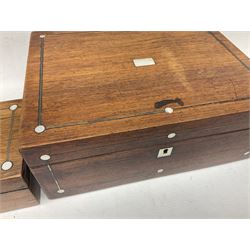 Two rosewood rectangular boxes with mother of pearl inlay decoration, together with a smaller walnut box with canted corners and brass inlay, largest L30cm