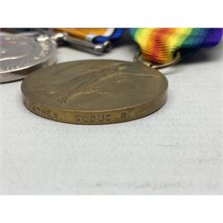 WW1 KIA group of three medals comprising British War Medal, 1914-15 Star and Victory Medal awarded to 9069 Cpl. J. Mayhew Glouc. R.; with ribbons; displayed on modern bar, and photograph of recipient in uniform; some biographical details