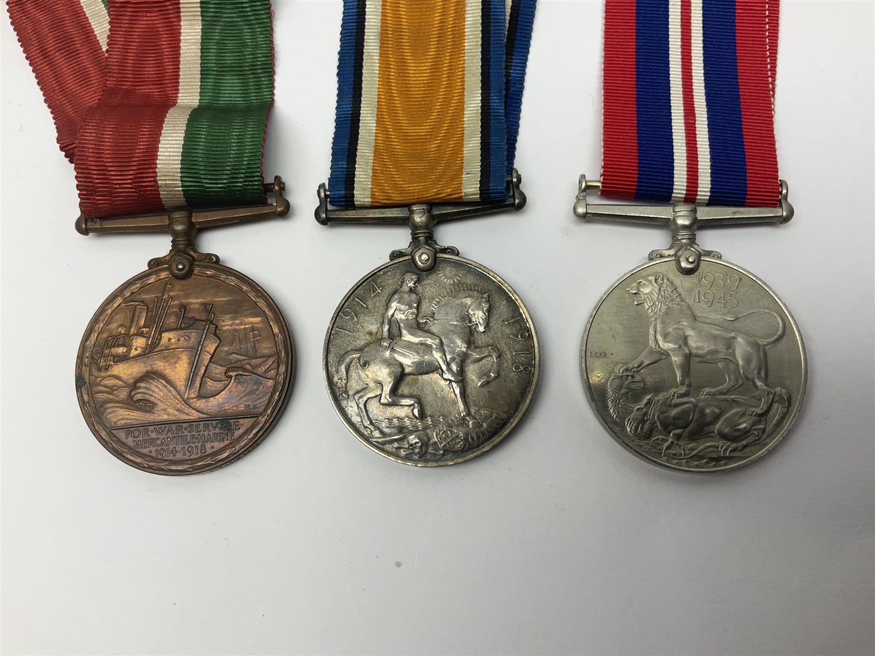 WW1 pair of medals comprising British war medal and Victory Medal awarded to 19774 Pte. G. Headlam Sea. Highrs.; another WW1 pair of medals comprising British War Medal and Mercantile Marine Medal awarded to Charles Filburn; WW2 group of five medals comprising 1939-45 War Medal, Defence Medal, 1939-45 Star, Africa Star and Burma Star; in issue box addressed to Mr. H, Smithson with medal slip; all with ribbons; and Edward VIII Coronation medal (10)