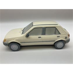 Lladro figure, Ford Fiesta, modelled as a Ford in beige, special commission by the Ford factory in Valencia, original box, no 7608, year issued 1989, year retired 1989, H9cm 