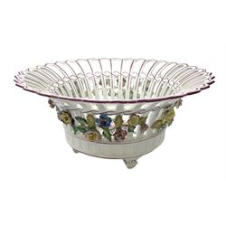 Early 20th century Dresden floral encrusted pierced bowl, centrally painted with flowers, on four tapering supports, D30cm 
