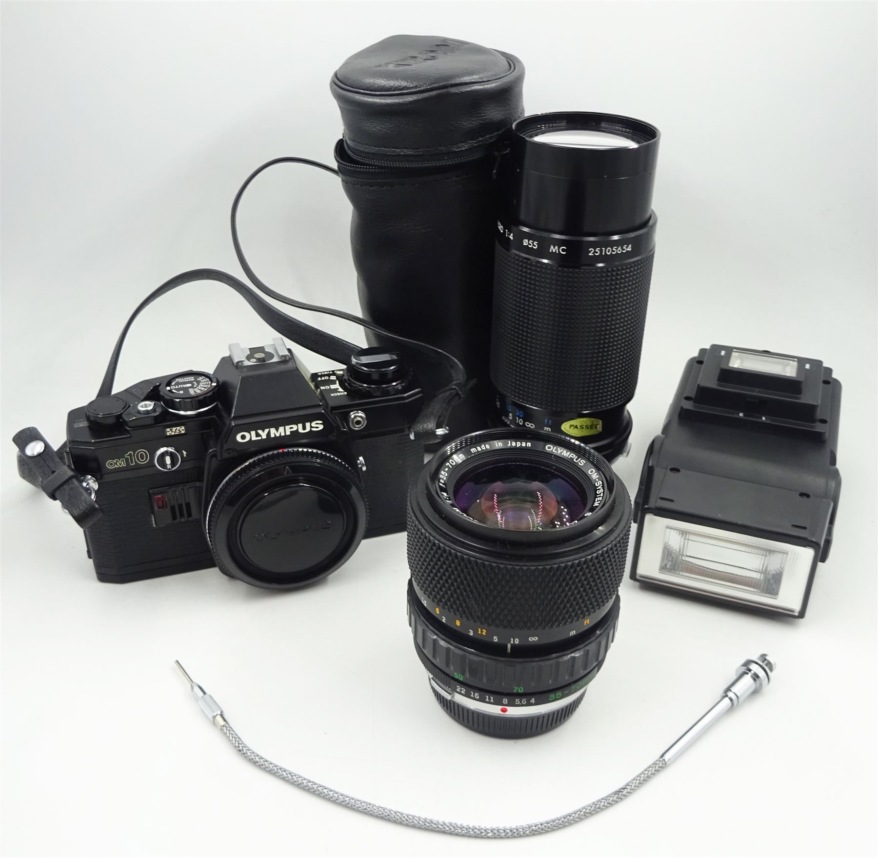 Olympus OM-10 SLR Camera with Olympus neck strap, Olympus OM-System S Zuiko Auto-Zoom 35-70mm 1:4 Lens, Kiron Macro 80-200mm 1:4 Lens in Kiron Protective Case, Ring 282 Twin Flash. 