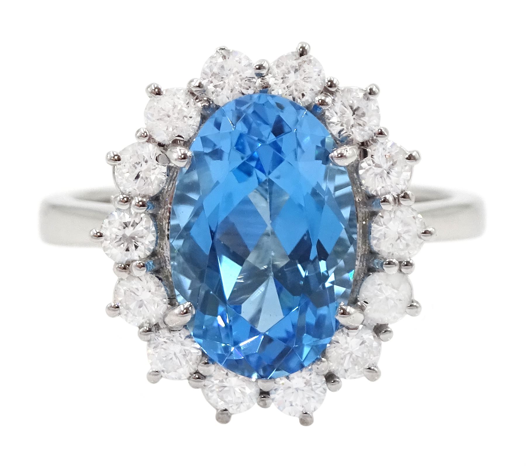 18ct white gold oval cut Swiss blue topaz and round brilliant cut diamond cluster ring, hallmarked