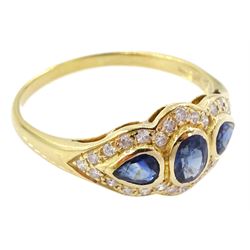18ct gold three stone oval and pear cut sapphire ring, with diamond set surround