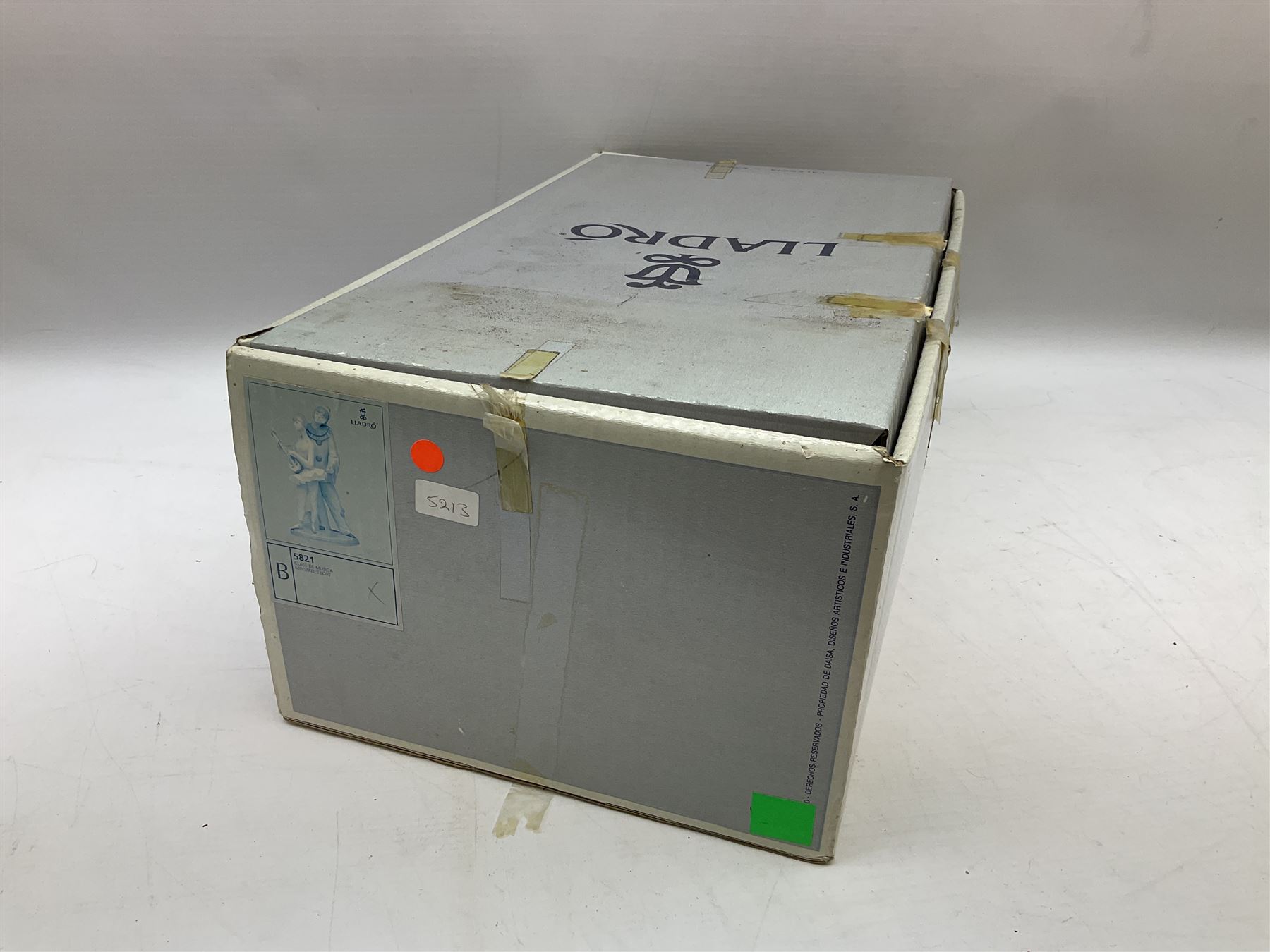 Lladro figure, Minstrel's Love, modelled as a couple entertaining, the lady in ballerina costume playing the lute and the gent stood behind her in jester type dress, sculpted by Rafael Lozano, with original box, no 5821, year issued 1991, year retired 1993, H31cm