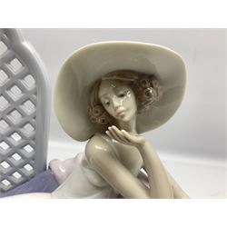 Lladro figure, Garden of Dreams, modelled as a woman reclining in front of trellis of flowers on a mahogany base, limited edition 2726/4000, sculpted by  José Puche, with original box, no 7634, year issued 1994, year retired 1996, H32cm