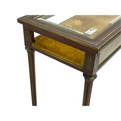 Walnut and brass inlaid bijouterie cabinet, the rectangular lid with bevelled glass pane inlaid with brass stringing, velvet lined interior, on tapering turned and fluted supports with brass collars and feet