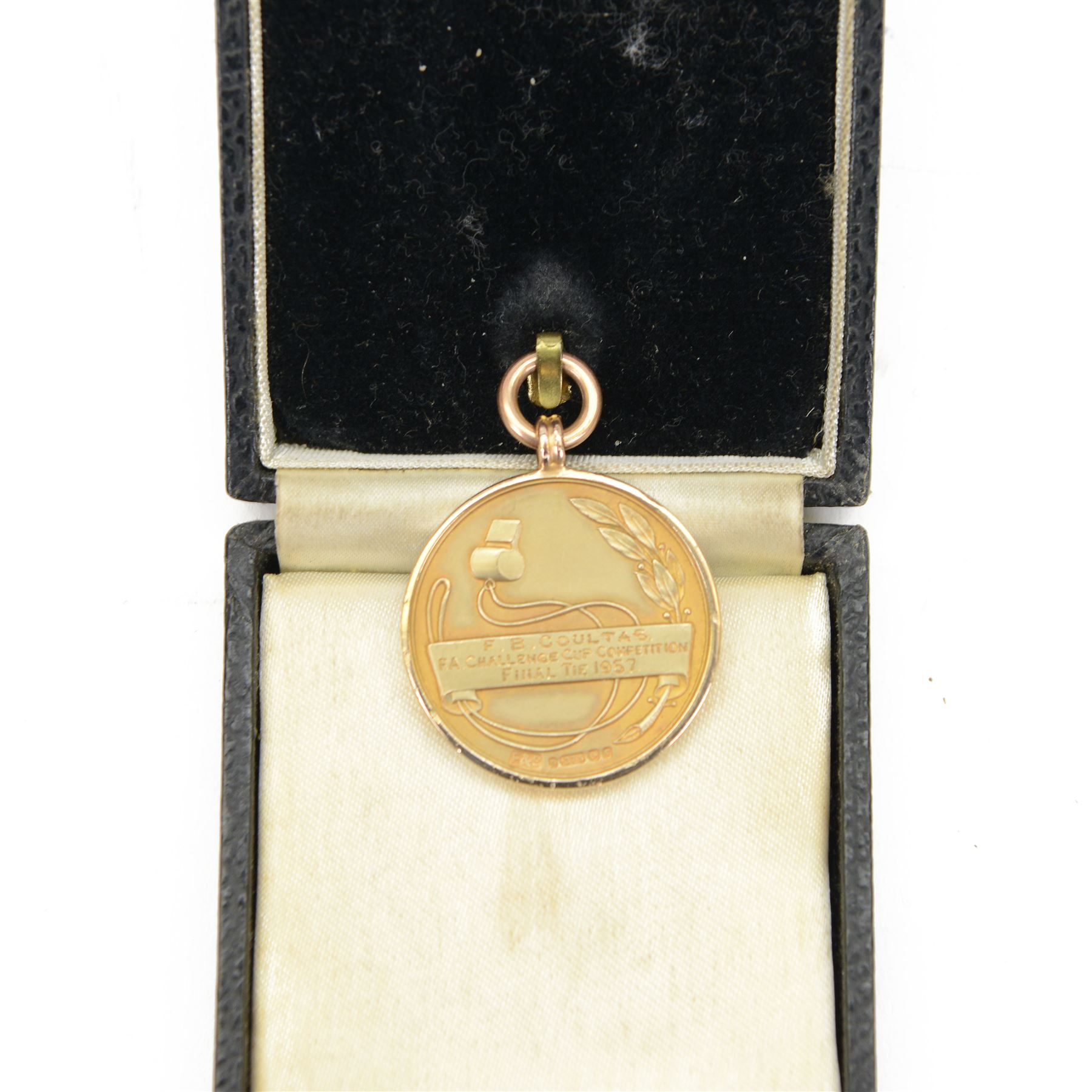 Collection of football memorabilia belonging and relating to the Hull based referee Frank Coultas, including 9ct gold Referee's medal for the 1957 Aston Villa v Manchester United FA Cup Final, inscribed 'The Football Association, F.B Coultas, F.A. Challenge Cup Competition, Final Tie 1957', hallmarked and in original case; the kit worn by him to referee the 1957 FA Cup Final and ephemera relating to the match including photographs, programmes and tickets; together with other football memorabilia collected by Frank Coultas, including programmes, photograph and ticket stubs, with some items relating to the 'Busby Babes'