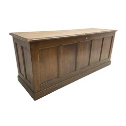Illingworth Ingham and Co. School Furnishers (Leeds c1900) - early 20th century oak rostrum or headmaster's desk, rectangular top, the front and sides panelled with open reverse, on plinth base