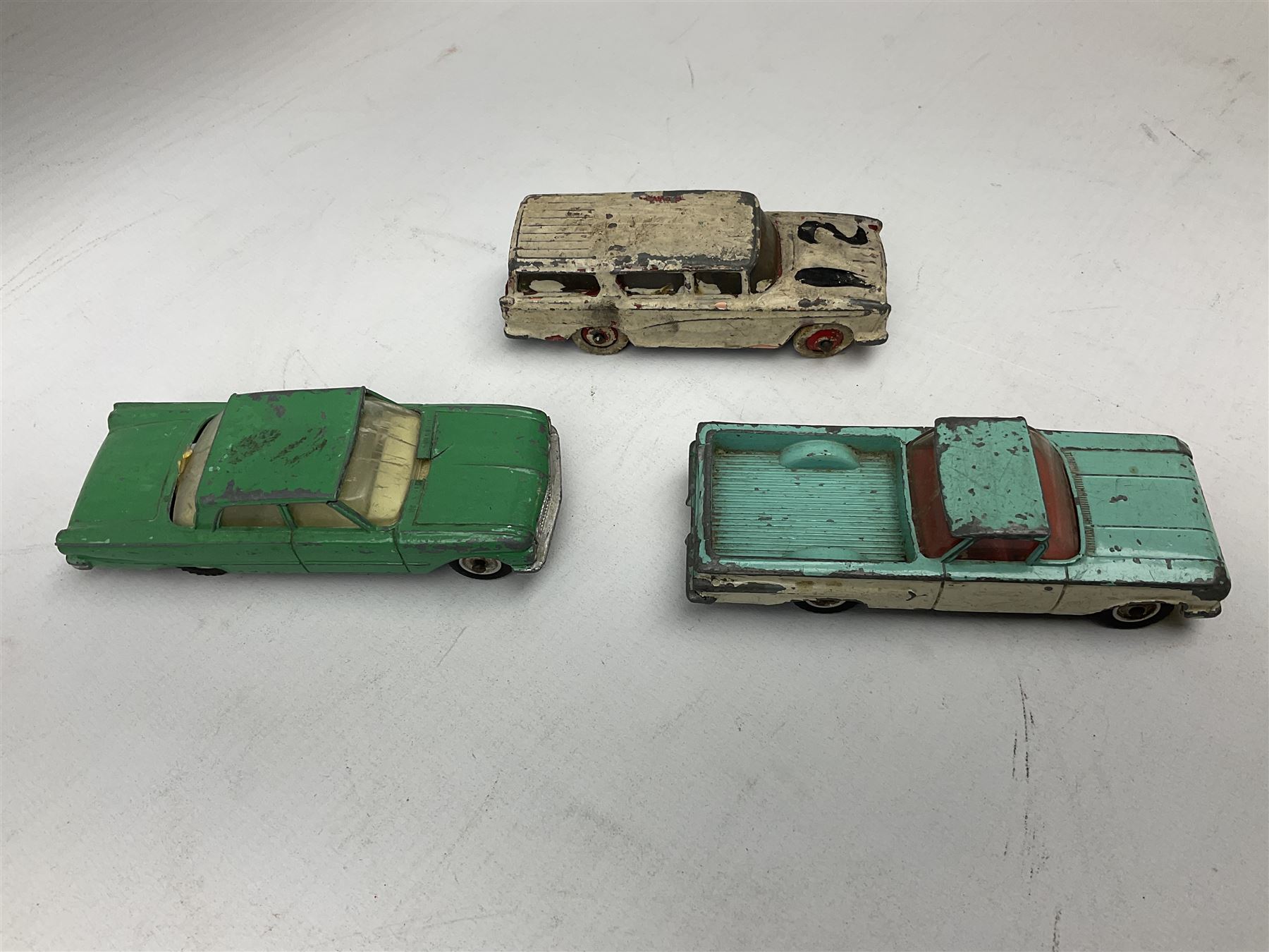 Dinky - thirteen unboxed and playworn/repainted early die-cast cars including Packard No.132, Austin A105 No.176, Rolls-Royce Silver Wraith No.150, Triumph Herald, Hillman Imp No.138, Rolls-Royce Phantom V No.198, Jaguar 'E' Type 2+2 No.131, Chevrolet El Camino No.449, French Panhard 24 No.524, Hudson Hornet No.174 etc; and Matchbox Dinky 1955 Bentley 'R' Type Continental (14)