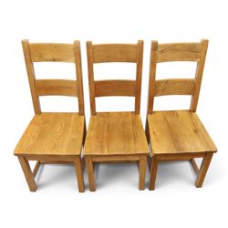 Indigo Furniture - large rustic oak dining table, rectangular four plank top raised on square supports; with set of six beech high ladder-back dining chairs