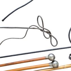 20th Century hunting whip with horn handle, together with another hunting whip, two swagger sticks for Oakham School and Dean Close School, and a walking stick