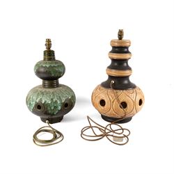 West German Pottery - two mid 20th century ceramic lamp bases, brown glaze with petal style decoration and pierced detail, together with another similar with volcanic glaze, largest H52cm