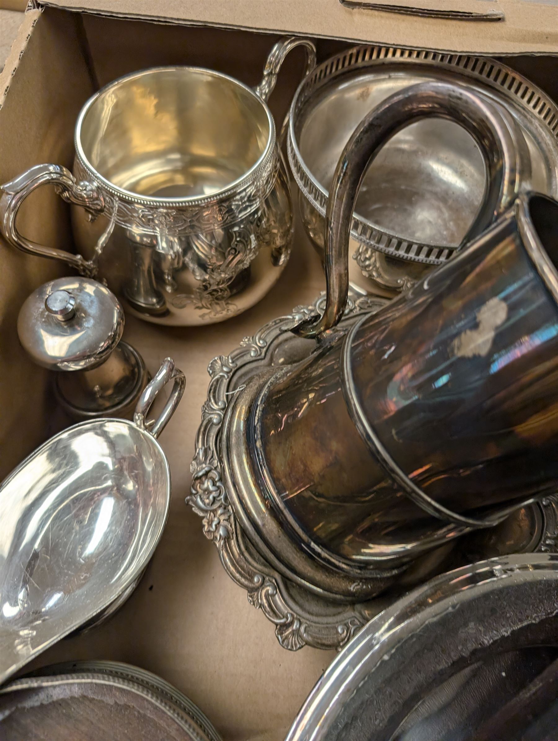 Silver plated items, including coffee pot with bone finial, set of six cased teaspoons and sugar tongs, twin handled cup, tankards, bottle coasters and sauce boat, together with pewter tankard and other metal ware