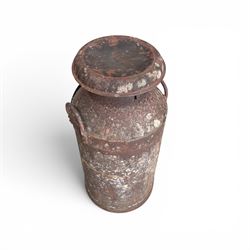 19th century milk churn with weathered patina along with aluminium watering can