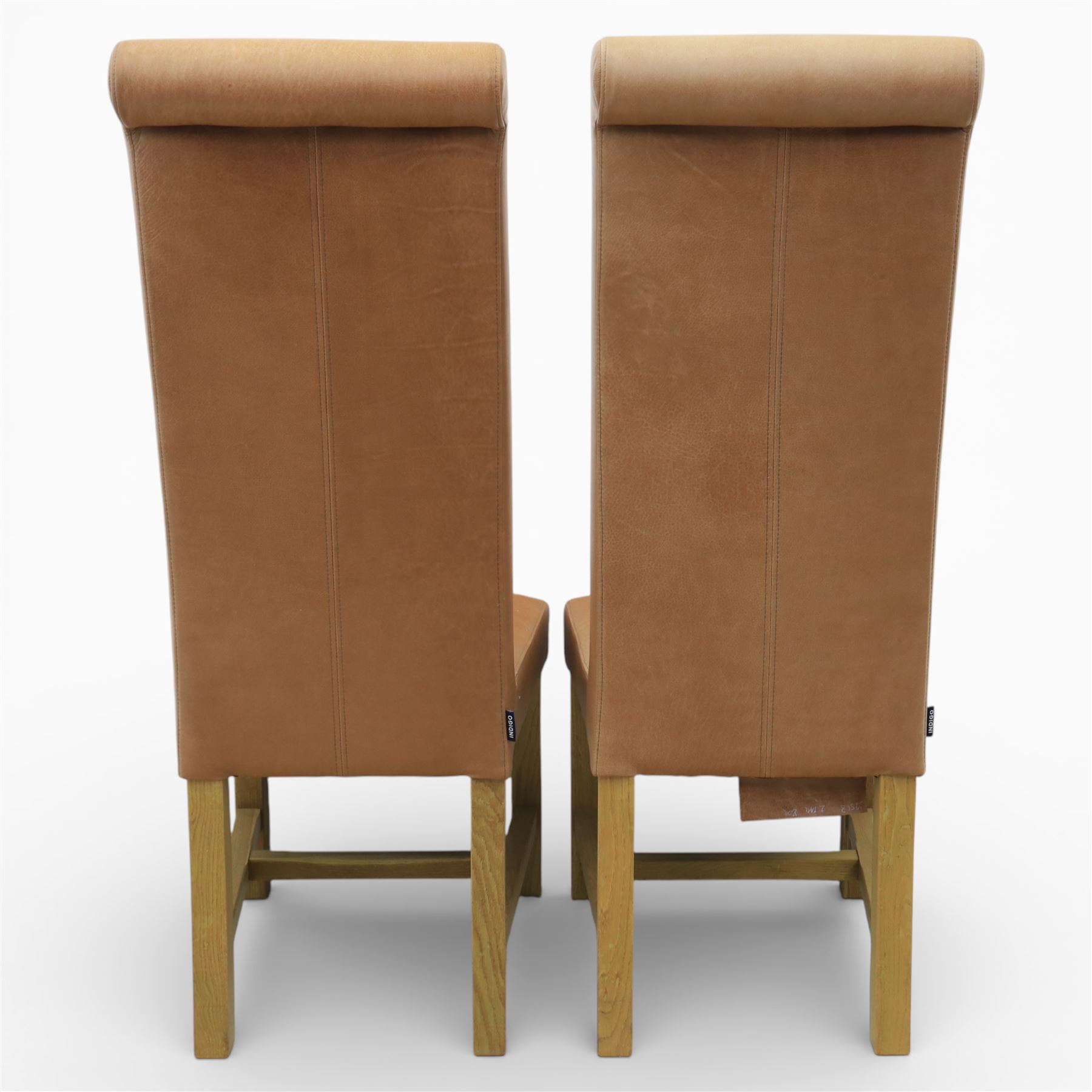 Modern large oak plank top dining table and twelve brown leather high back chairs, table of rustic construction five solid planks with exposed supports, the chairs in brown leather hide with ten standard height and a pair of taller chairs for the foot and head of the table