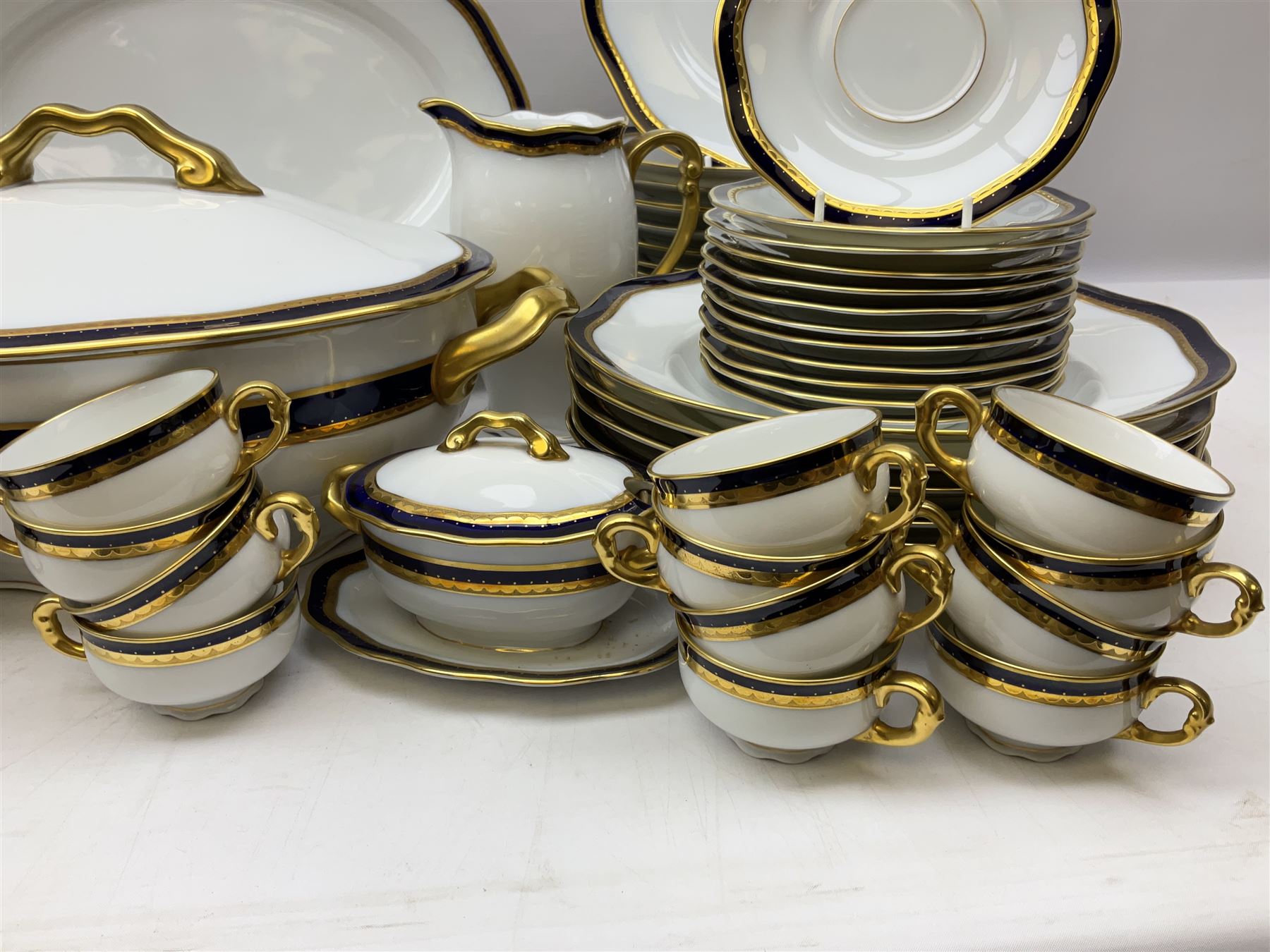 Pirkenhammer of Czechoslovakia Carlsbad pattern tea and dinner for twelve place settings to include dinner plates, soup bowls, side plates, covered tureen, tea cups and saucers, coffee cups and saucers, teapot, milk jug, covered surier, etc, with an addition twelve dinner plates (110)