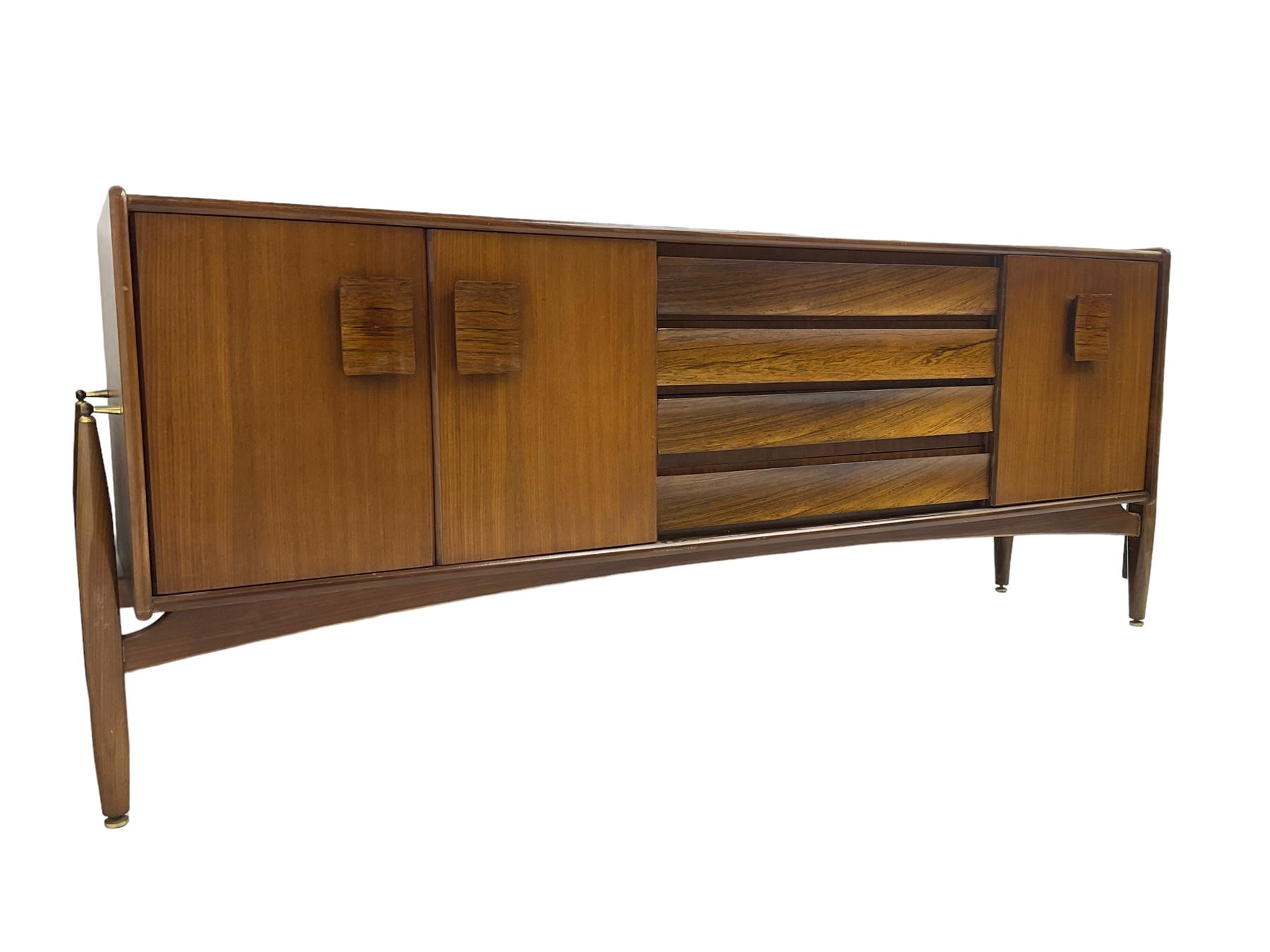 Elliots of Newbury (EoN) - mid-20th century teak sideboard, fitted with four central doors flanked by fall-front cupboard and a double cupboard, each with concave wooden handles