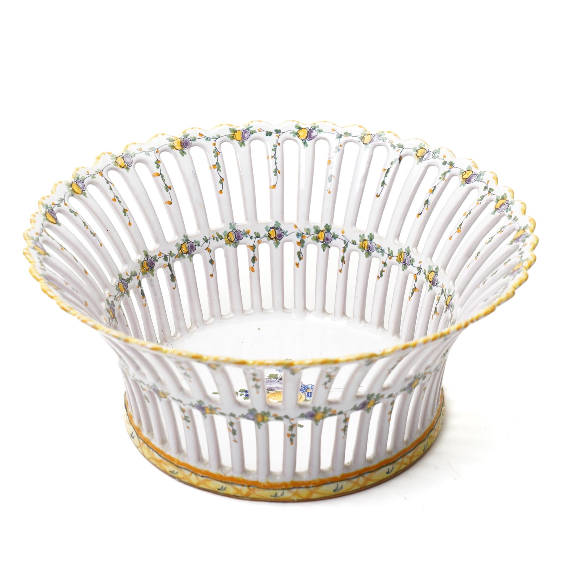 Two 20th century French faience openwork baskets, by Emile Tessier Malicorne, painted with polychromatic floral decoration, with scalloped rims, marked to base, larger 9cm (2)