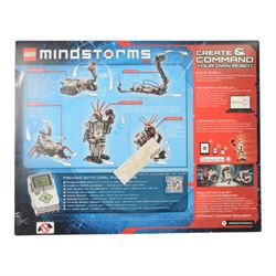 Two Lego Mindstorms sets, comprising 8547 NXT 2.0 and 31313 EV3, both partially built with boxes and instructions