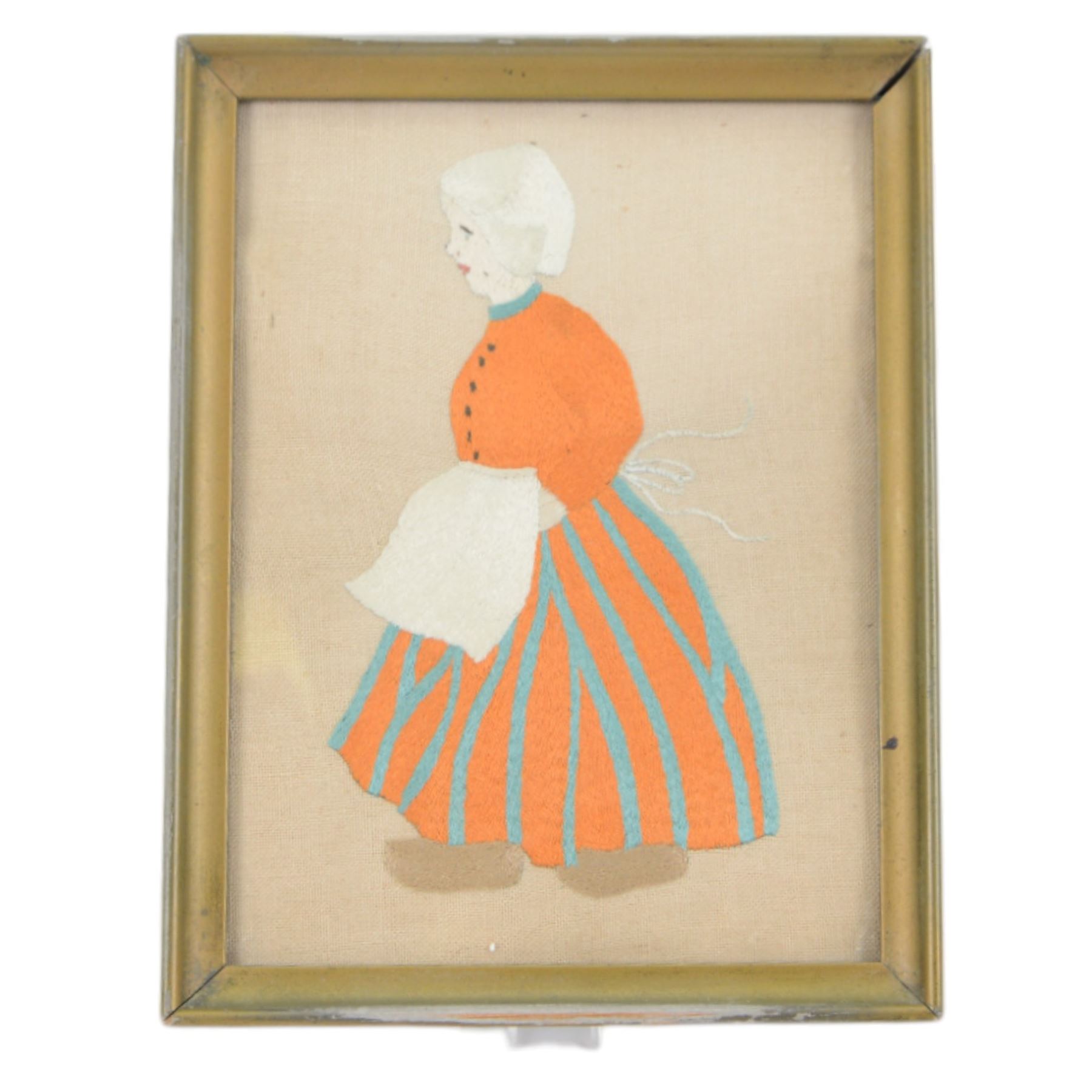 Four silkwork embroidery portraits, including two Dutch women, man smoking a pipe and a woman in period dress, all framed