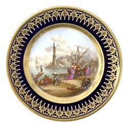 19th century French cabinet plate, hand painted with a central panel depicting dockside scene with boats and conversing figures, with ships and buildings in the background, within a dark blue gilt detailed border, D23cm