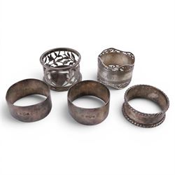 Silver pepper grinder, sifting ladle, silver handled spoon and eight silver napkin rings, all stamped or hallmarked