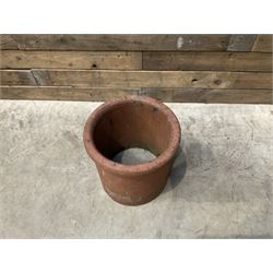 Cast iron cauldron set pot with 2 terracotta chimney pots and 2 terracotta planters,