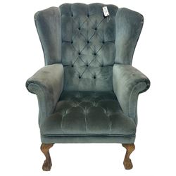 Georgian design wingback armchair, traditional shape with rolled arms, upholstered in teal velvet fabric, on cabriole supports with ball and claw feet