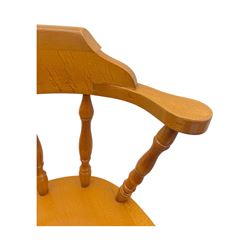 Pair of late 20th century beech bar stools, with curved top rail and turned spindle back, shaped seat over four turned legs united by multiple stretchers