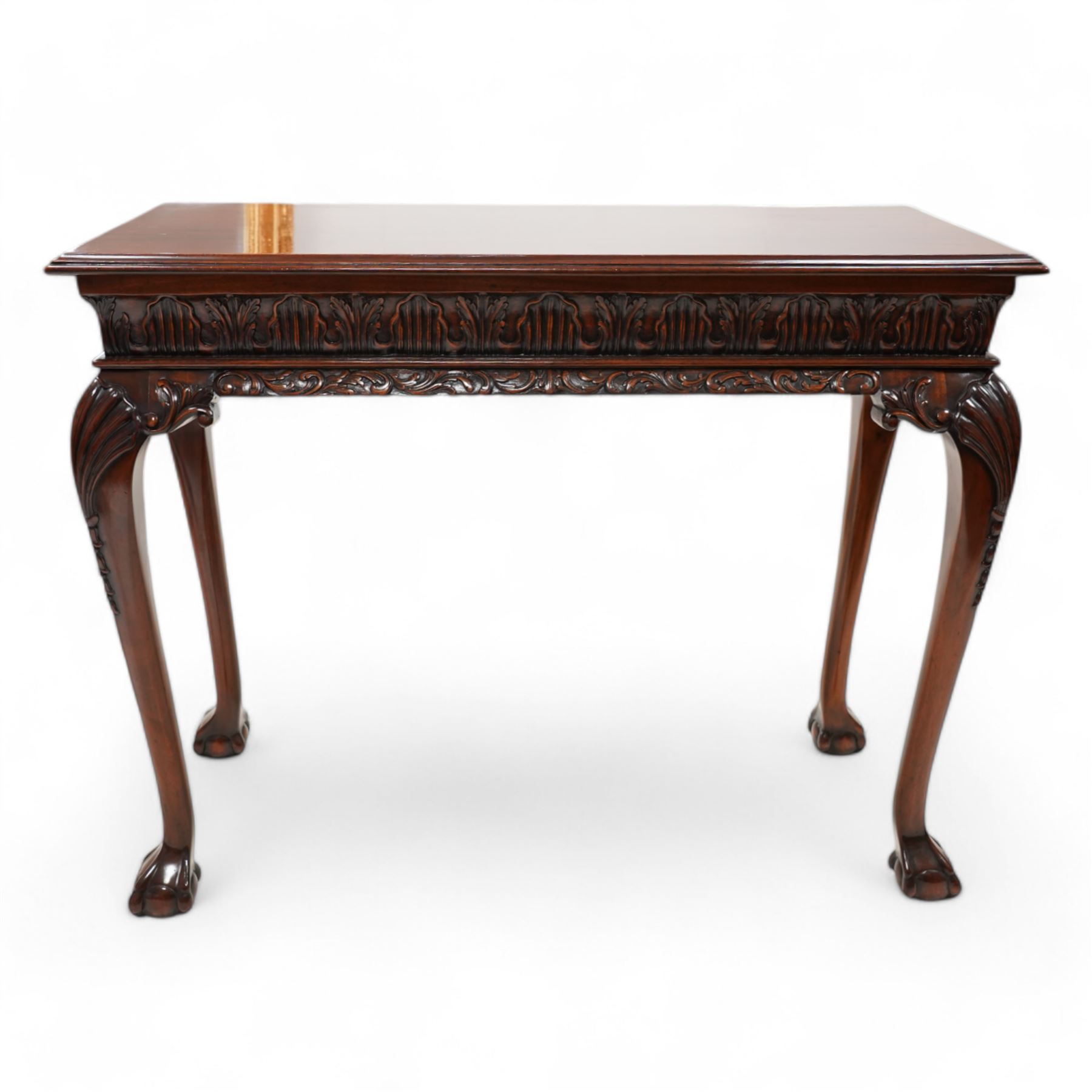Georgian design mahogany console or side table, moulded rectangular top over palmette carved frieze, decorated with scrolling leafage, shell and bell flower carved cabriole supports with ball and claw feet 
