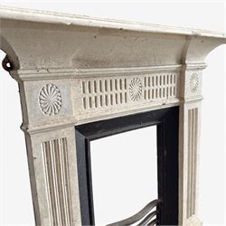 19th century Neoclassical design cast iron bedroom fire surround with fluted and rosette design, white painted finish with  black slip