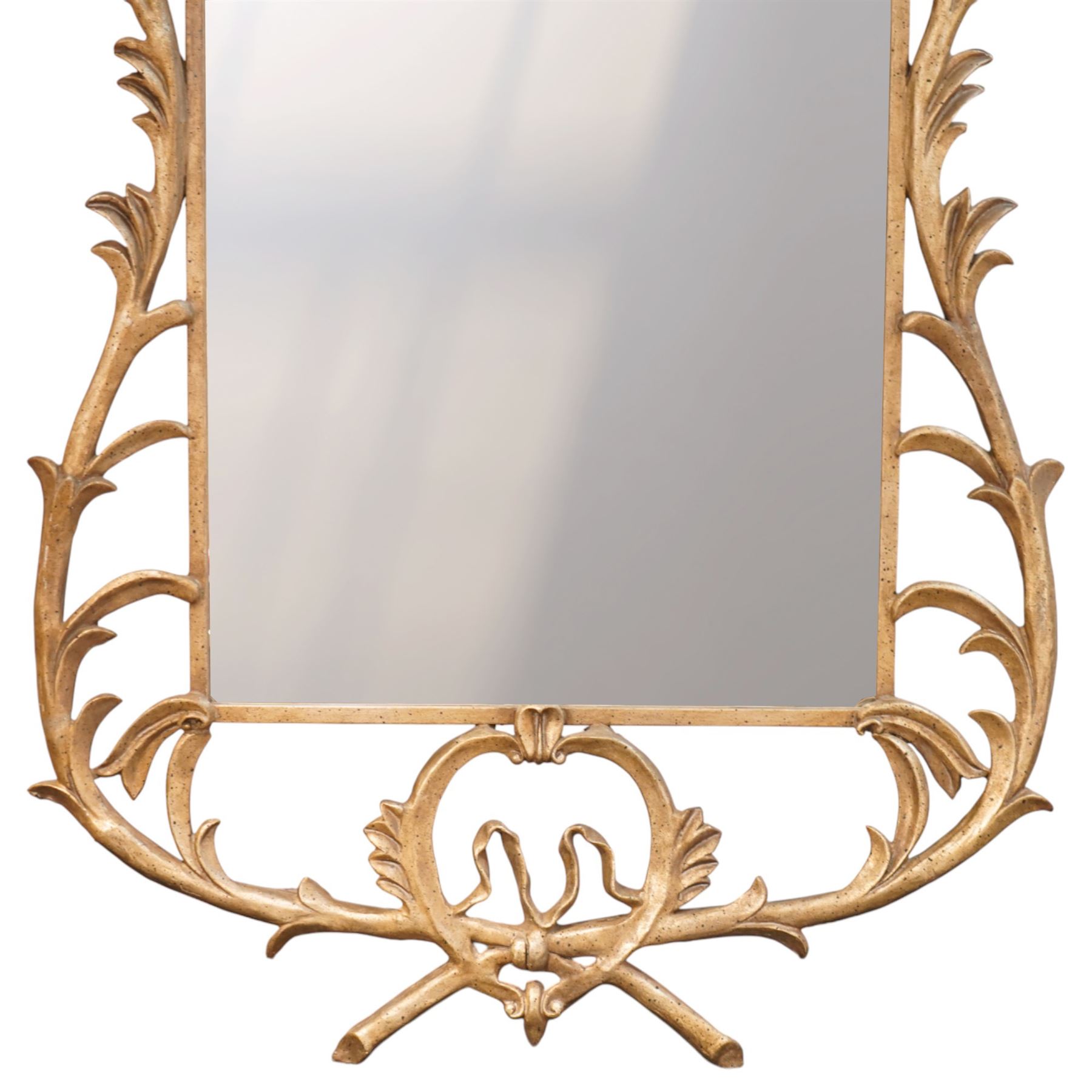 Large metal framed wall mirror, of rectangular form within an ornate openwork frame cast with scrolling foliate decoration and pierced cresting, finished in a gilt tone