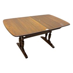 Ercol - late 20th century oak refectory dining table, rectangular top with rounded corners and central extending leaf, raised on turned baluster supports united by a stretcher (Extended 200cm)