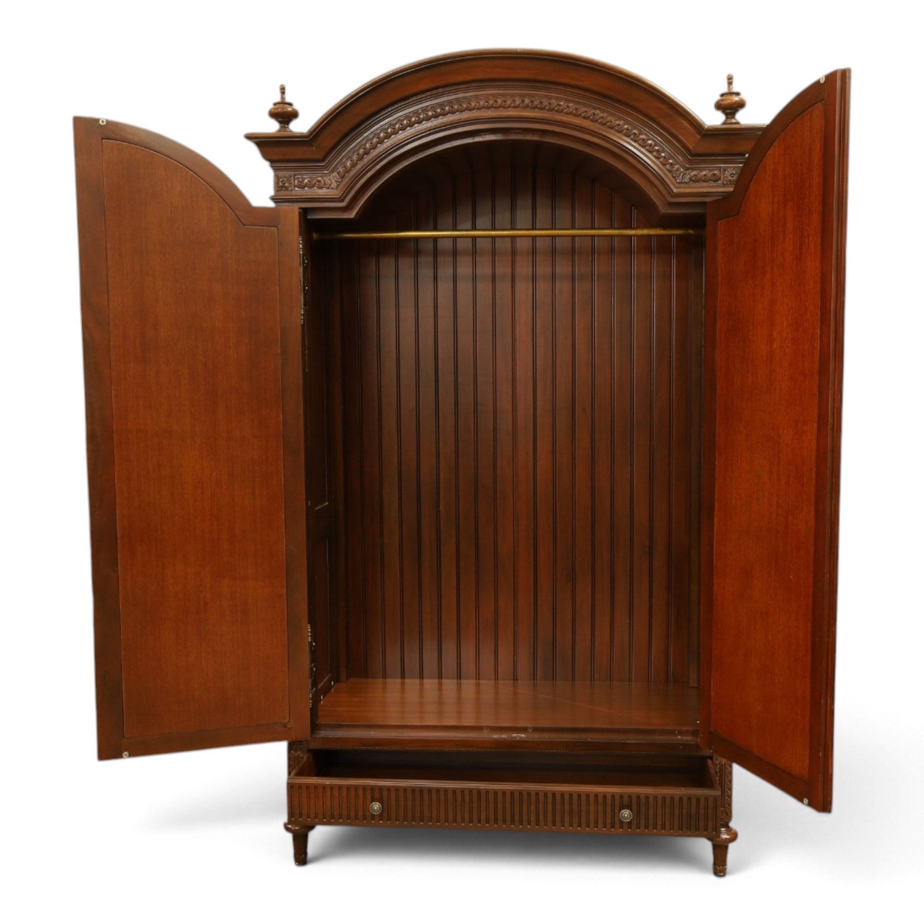 And So To Bed - French design ‘Eclectic’ double wardrobe in dark finish, arched moulded cornice with carved foliate band and turned finials, two mirrored doors enclosing a hanging rail, flanked by turned columns with foliate decoration, single fluted drawer below, on turned tapering feet