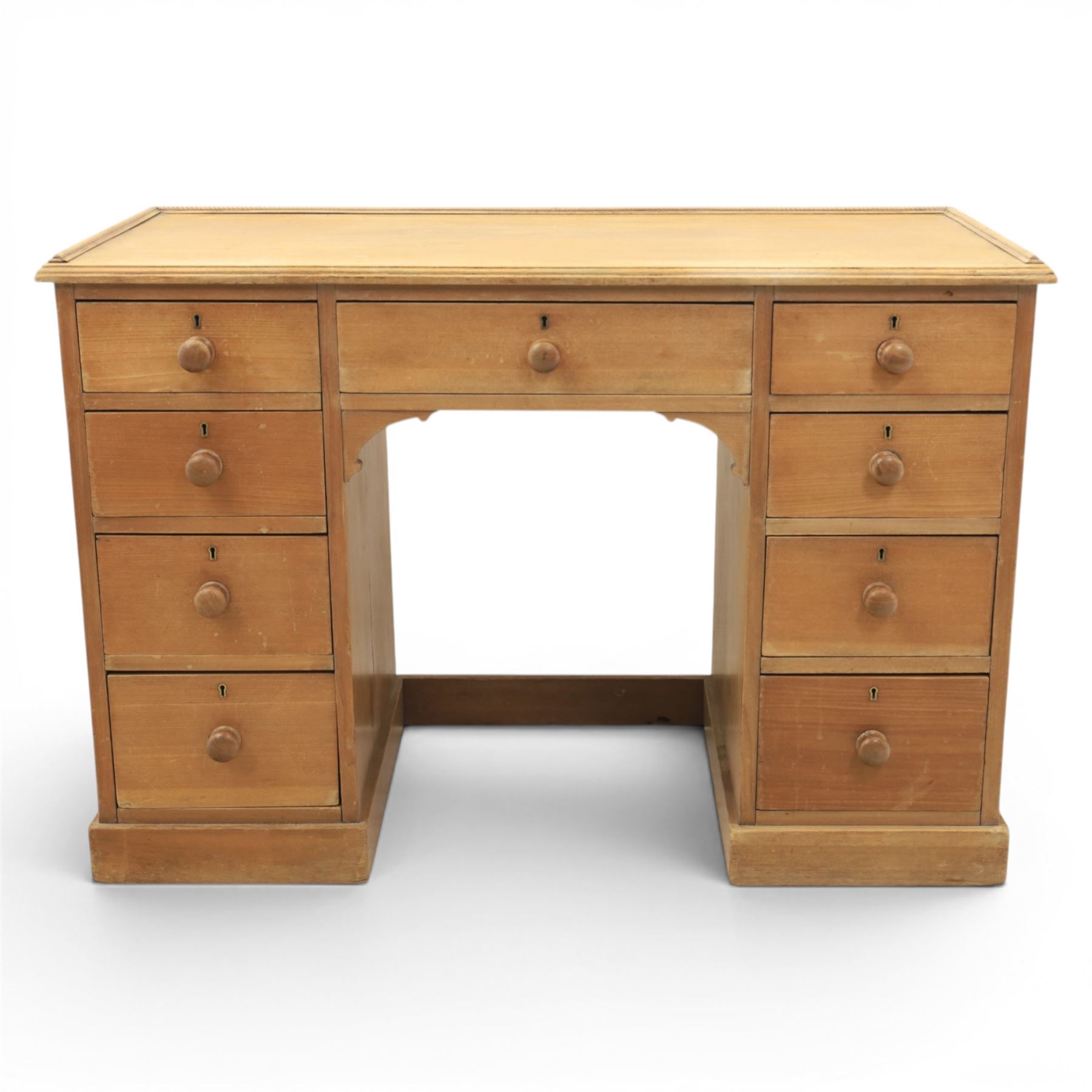 20th century ash twin pedestal desk, gadroon galleried top, twin bank of graduated drawers, plinth base
