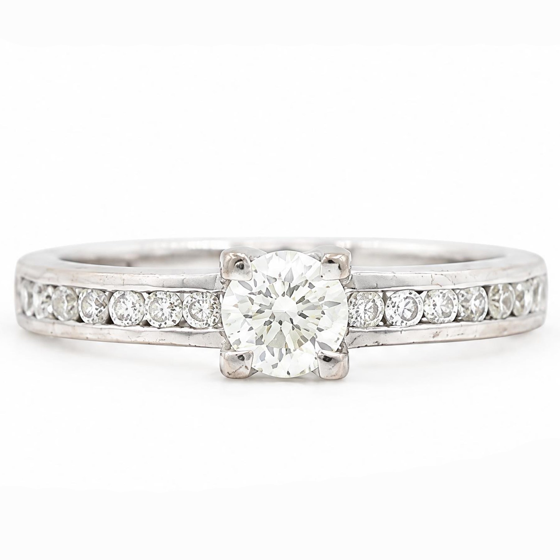 18ct white gold diamond ring, four claw set with a single round brilliant cut diamond of approx 0.40 carat and diamond set shoulders, London 2011