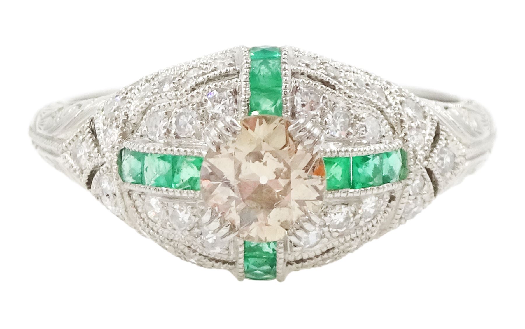 Platinum emerald and diamond ring, the principal transitional cut diamond of 0.41 carat, with milgrain set calibre cut emeralds and single cut diamonds surround and engraved foliate decoration shoulders, stamped Plat