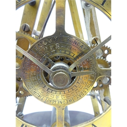  Early 20th century electric skeleton clock, the pyramid shaped brass frame with circular Roman dial and central inner day & date dials, hipp-toggle escapement, with twin train movement, on oval wooden base, H38cm, W31cm    